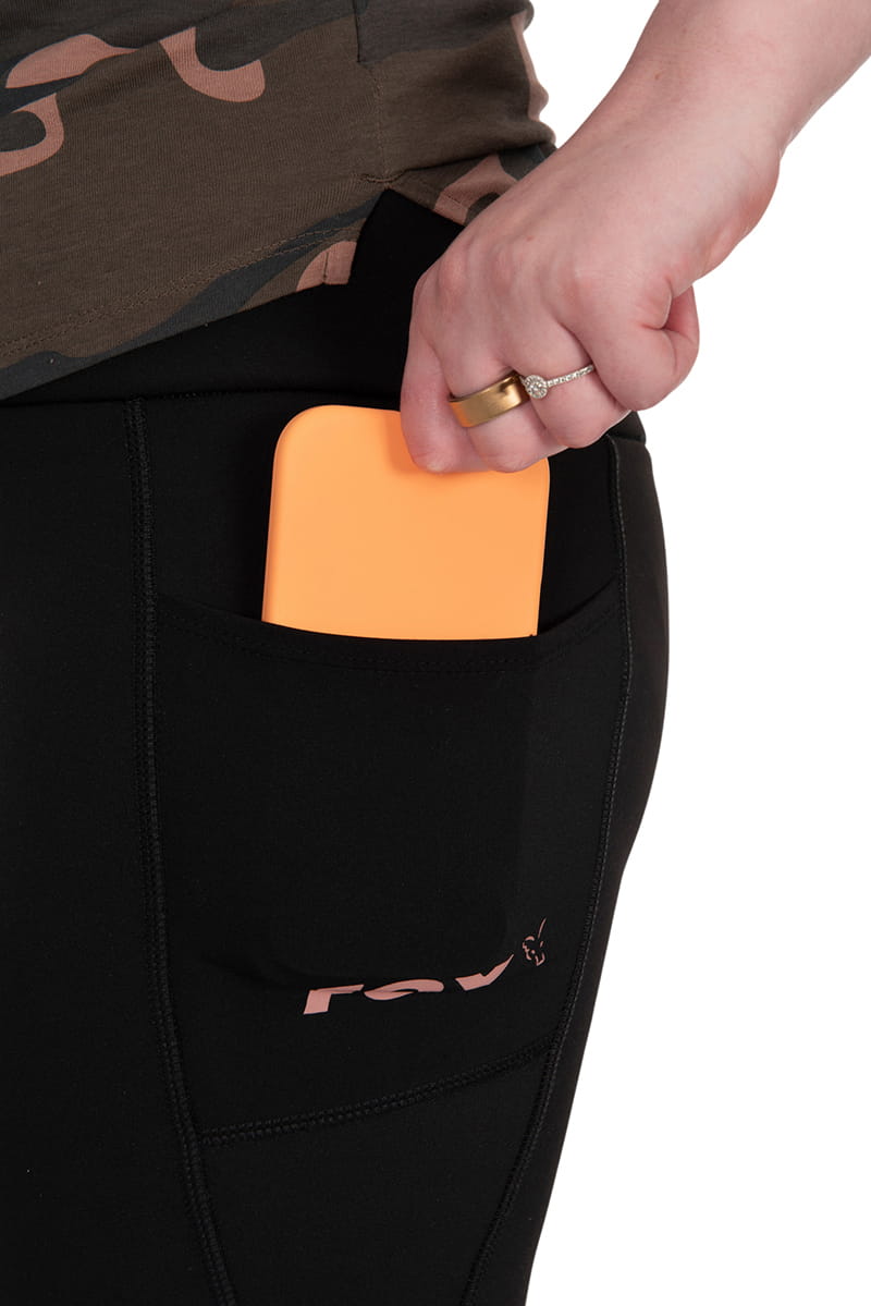 orange phone, t pocket, midsection, leggings, phone case not visible