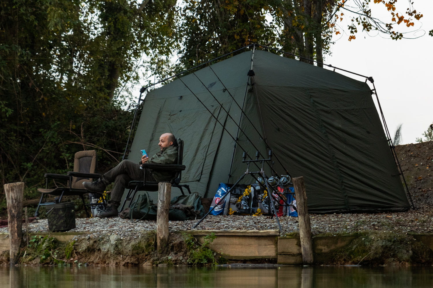 camping tent, outdoor campsite, fishing setup, campchair, camping gear