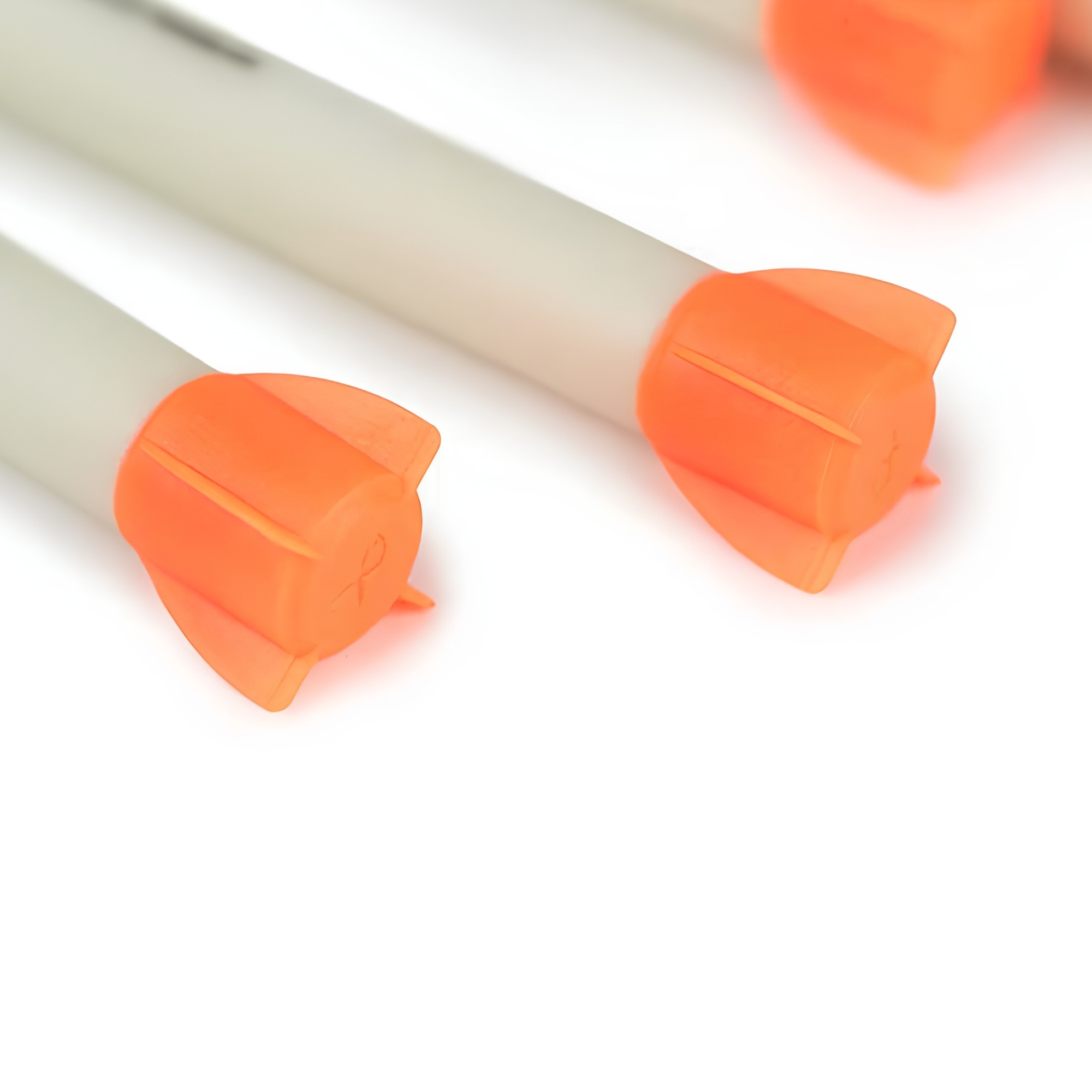 orange tips, glue tabs, plastic tips, safety tips, capping ends